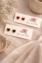 Load image into Gallery viewer, Black Heart with Gold Trim Stud Earrings – Edgy Elegance in a Polished Mini Heart