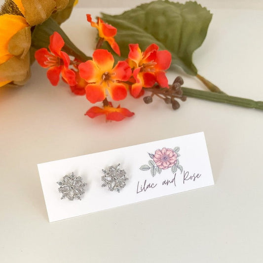 sparkling dainty studs in snowflake design