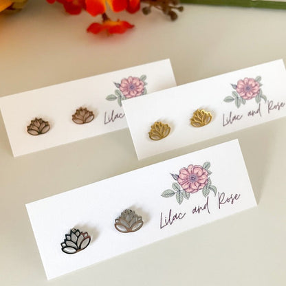 Lotus studs in Lilac and Rose packaging