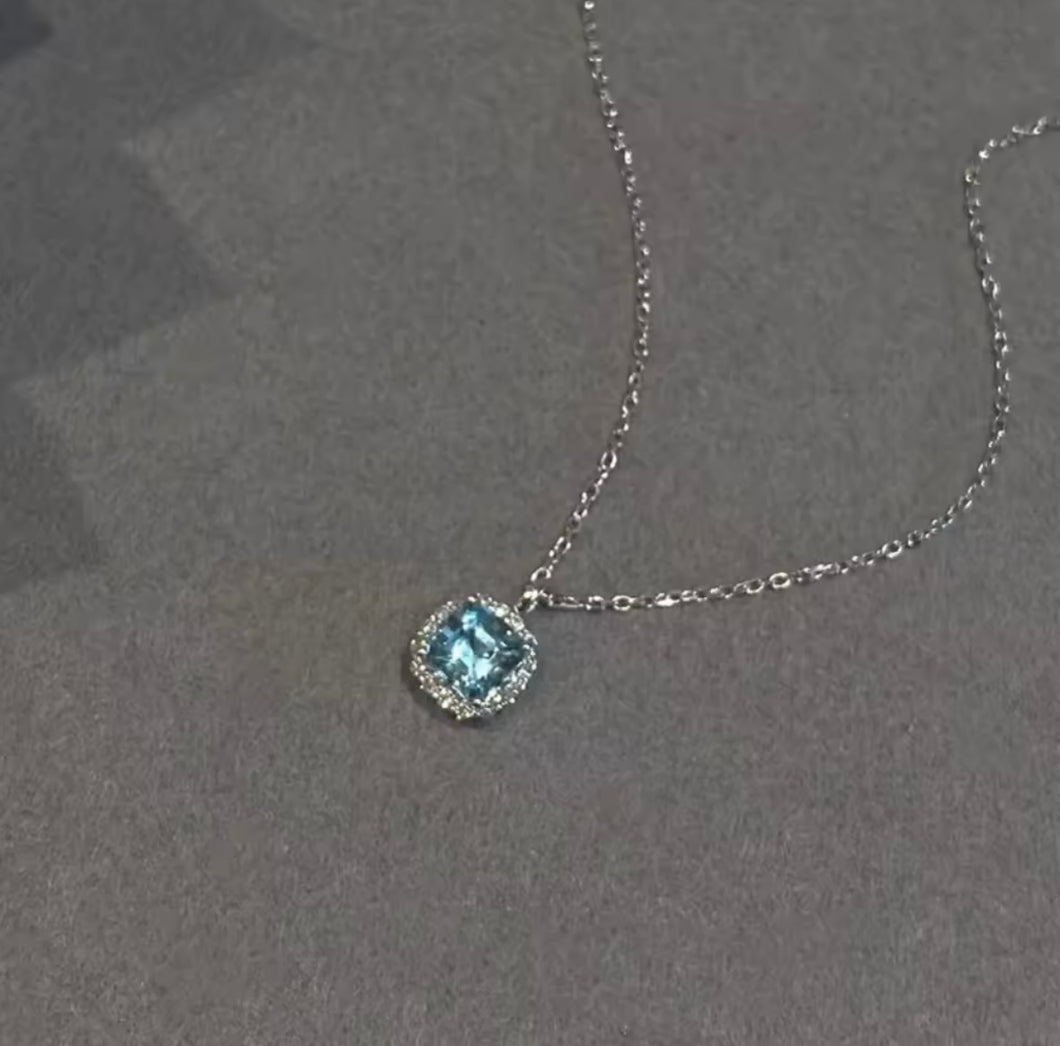 Gold necklace with sapphire blue cubic zirconia