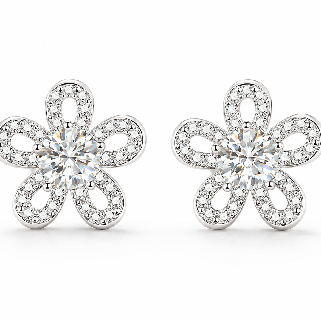 A pair of silver flower-shaped stud earrings set with clear round-cut and pave moissanite, shown on a clean white background.