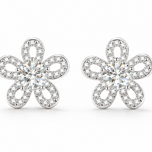 A pair of silver flower-shaped stud earrings set with clear round-cut and pave moissanite, shown on a clean white background.