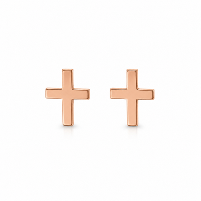 A pair of minimalist rose gold cross stud earrings on a clean white background.