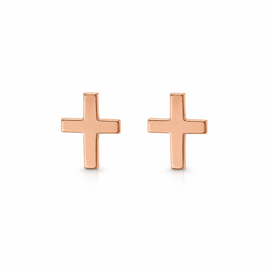 A pair of minimalist rose gold cross stud earrings on a clean white background.