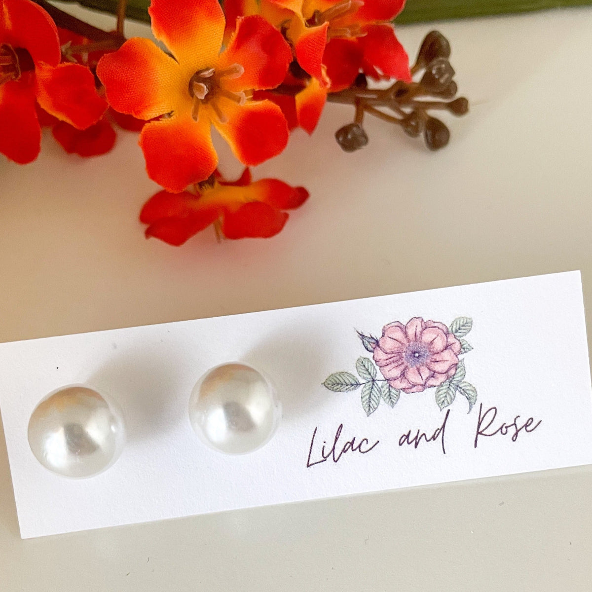 Classic pearl stud earrings on Lilac and Rose card